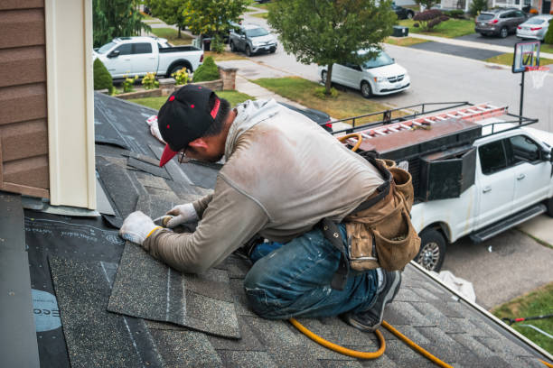 Professional Roofing technician working in Kewadin, MI